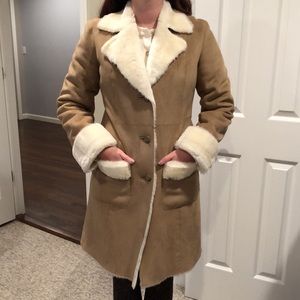 Tan Suede coat with white faux fur trim and inside.